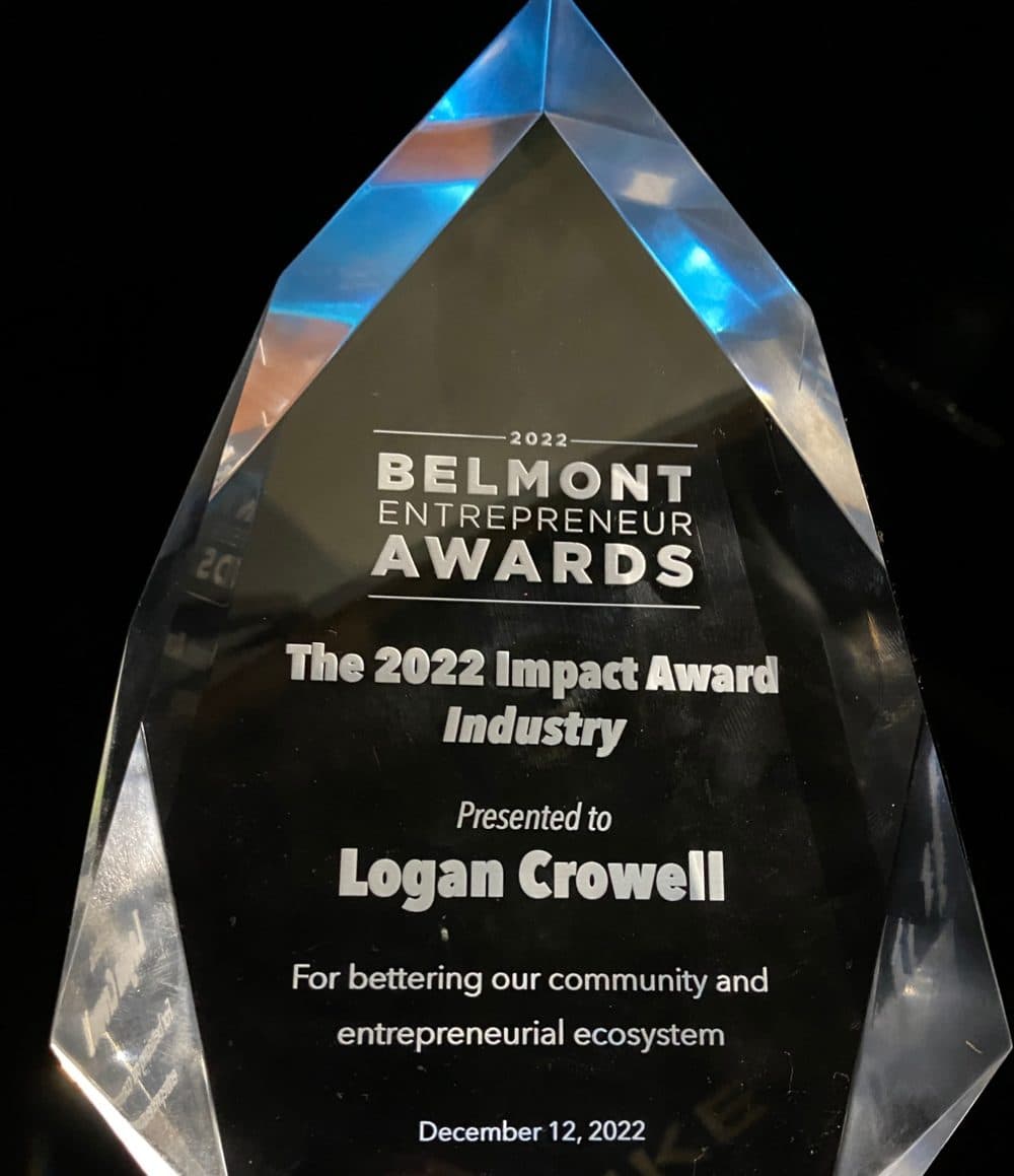 Crystal trophy: 2022 Belmont Entrepreneur Awards, The 2022 Impact Award, Industry, presented to Logan Crowell for bettering our community and entrepreneurial ecosystem